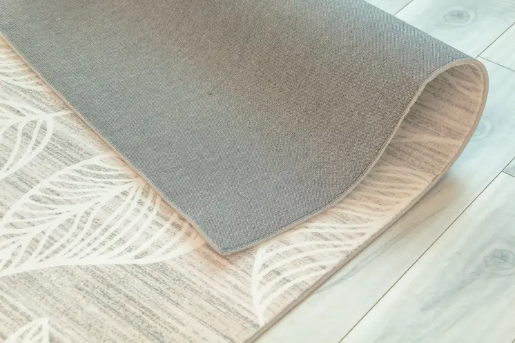 7' X 10' Beige and Ivory Floral Distressed Area Rug