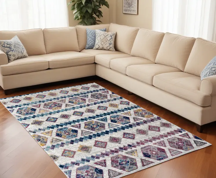 9' X 12' Ivory Blue and Orange Geometric Power Loom Area Rug