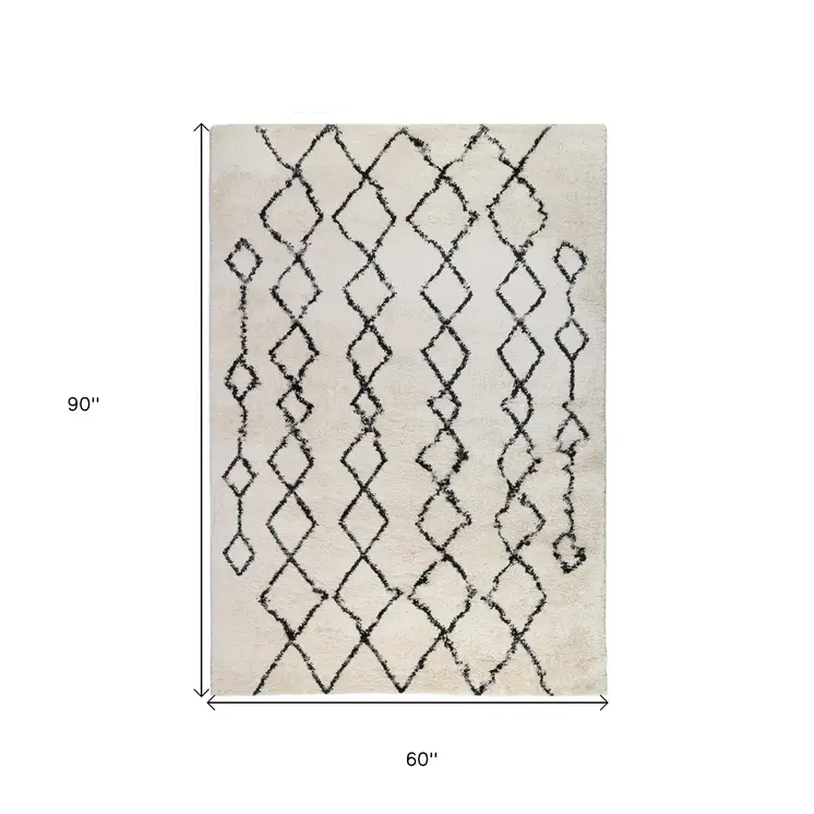 5' X 8' Ivory and Black Geometric Shag Area Rug