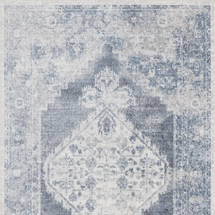 5' X 7' Blue and Ivory Abstract Power Loom Washable Area Rug