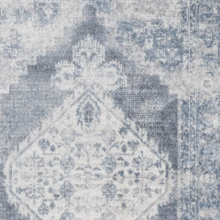 5' X 7' Blue and Ivory Abstract Power Loom Washable Area Rug
