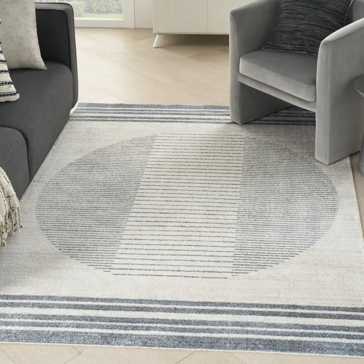 5' X 7' Blue And Ivory Geometric Washable Area Rug