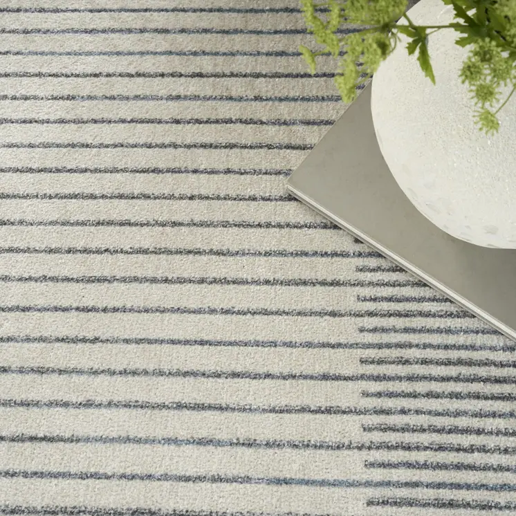 5' X 7' Blue And Ivory Geometric Washable Area Rug