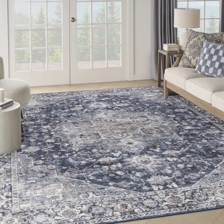 9' X 12' Blue and Ivory Floral Power Loom Distressed Washable Area Rug