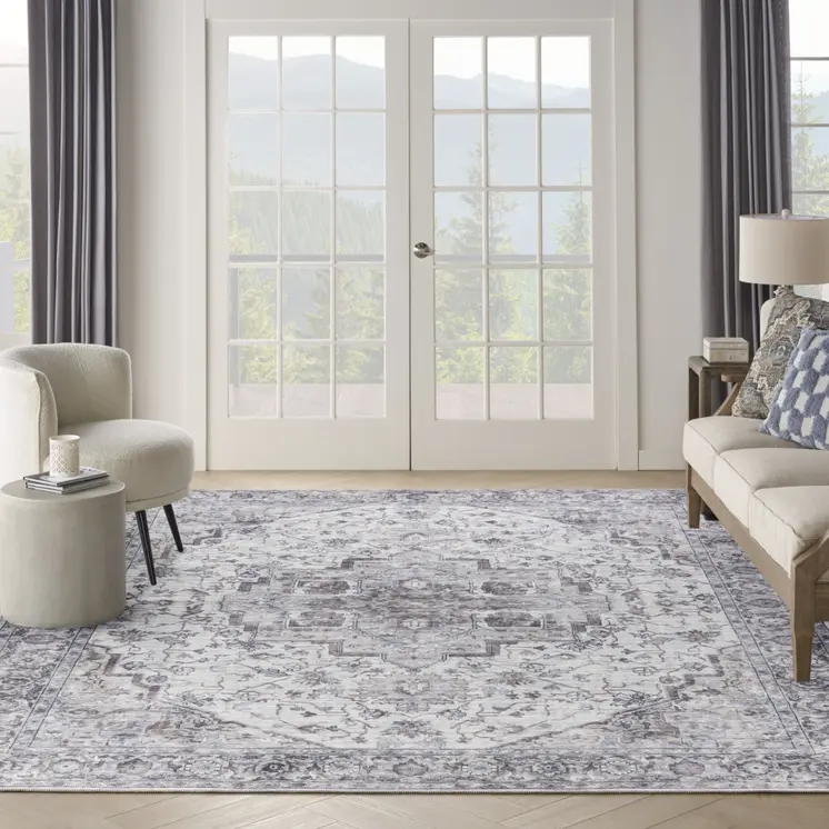 9' X 12' Beige and Ivory Floral Power Loom Distressed Washable Area Rug