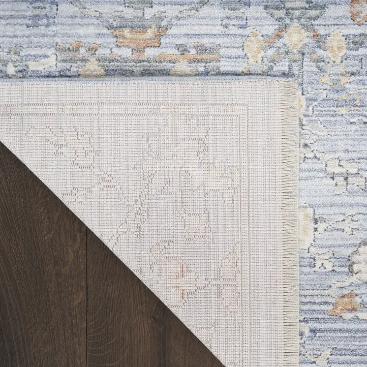 5' X 8' Blue and Ivory Oriental Power Loom Distressed Area Rug With Fringe