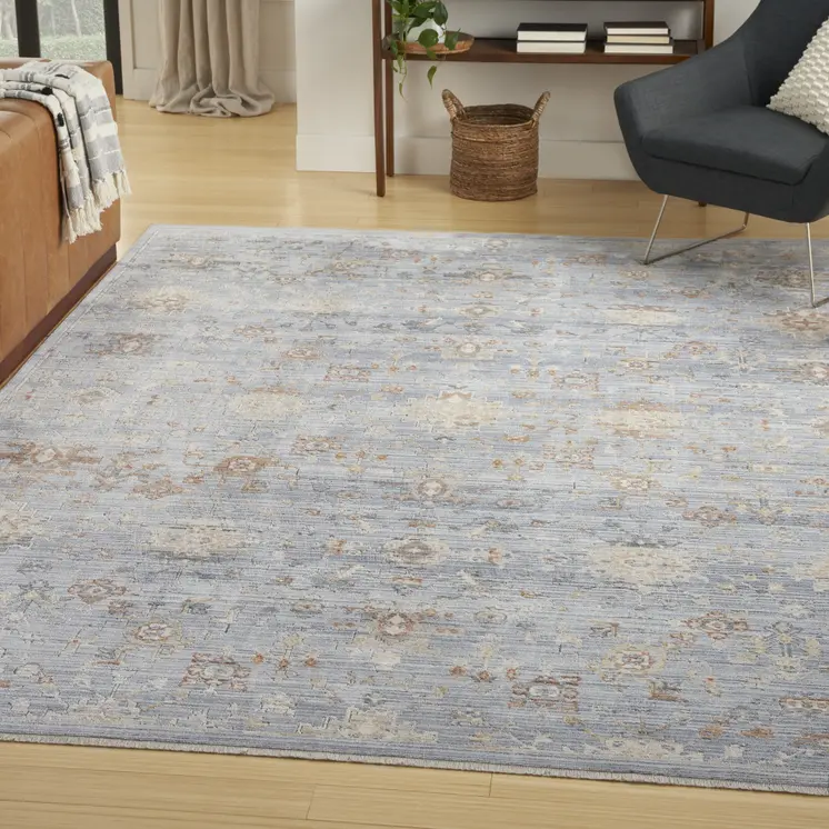 5' X 8' Blue and Ivory Oriental Power Loom Distressed Area Rug With Fringe