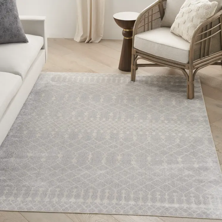 5' X 7' Blue and Ivory Abstract Power Loom Washable Area Rug
