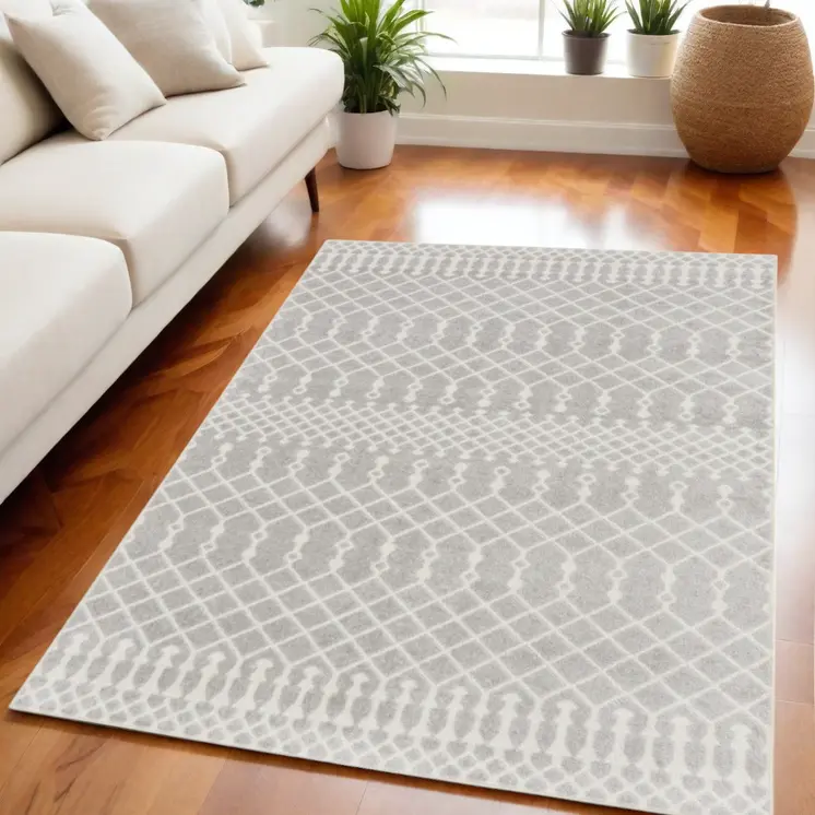 5' X 7' Blue and Ivory Abstract Power Loom Washable Area Rug
