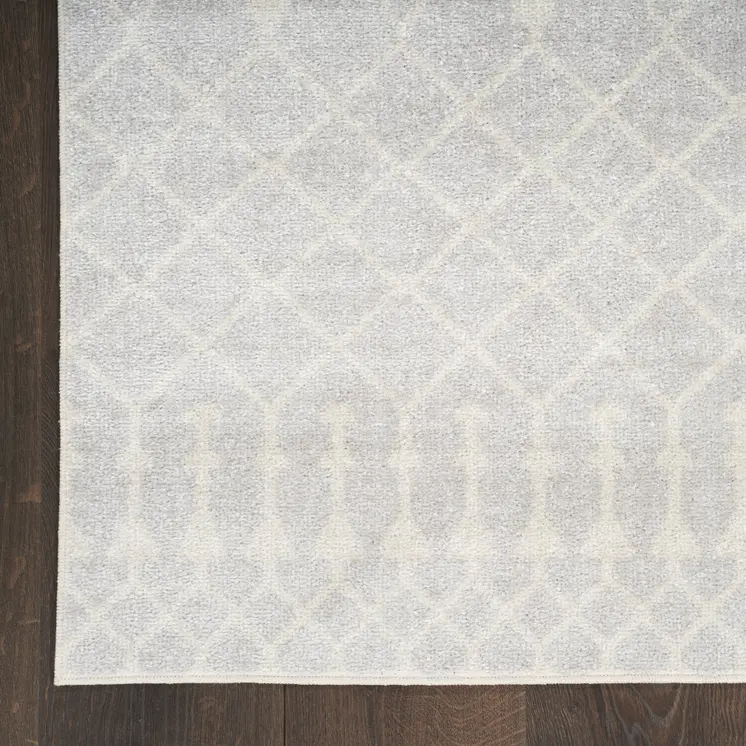 5' X 7' Blue and Ivory Abstract Power Loom Washable Area Rug