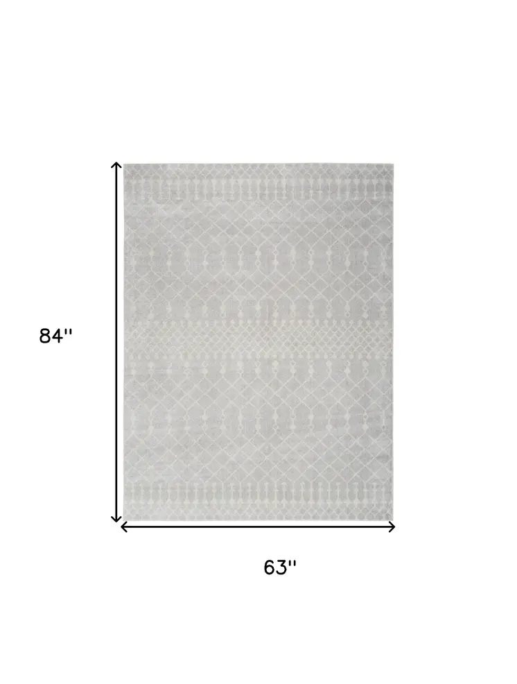 5' X 7' Blue and Ivory Abstract Power Loom Washable Area Rug