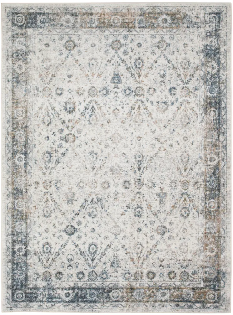 7' X 9' Blue and Ivory Floral Medallion Power Loom Distressed Washable Area Rug