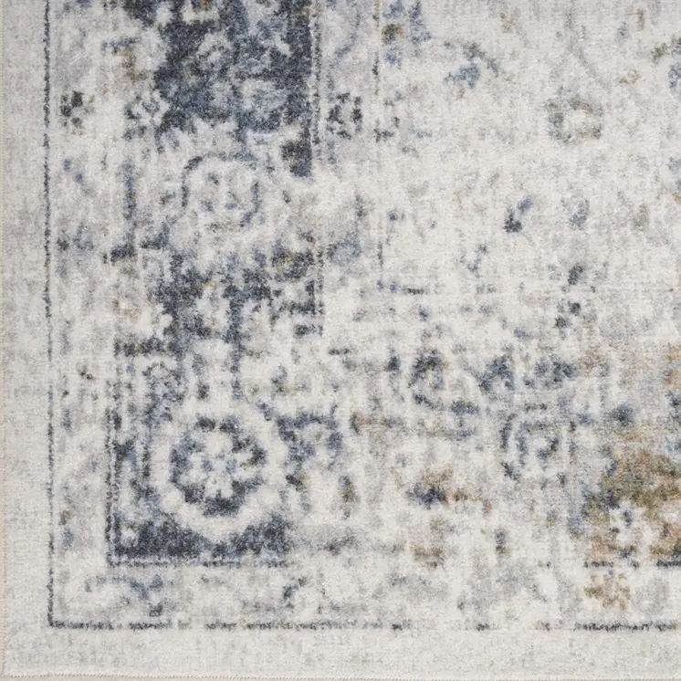 7' X 9' Blue and Ivory Floral Medallion Power Loom Distressed Washable Area Rug