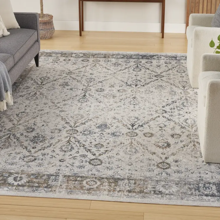 8' X 10' Blue and Ivory Floral Medallion Power Loom Distressed Washable Area Rug