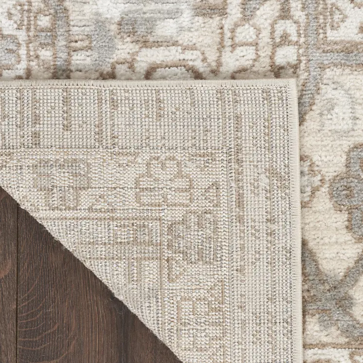 5' X 7' Beige and Ivory Medallion Power Loom Distressed Area Rug