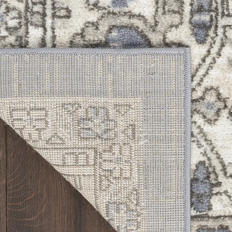 5' X 7' Blue and Ivory Medallion Power Loom Distressed Area Rug