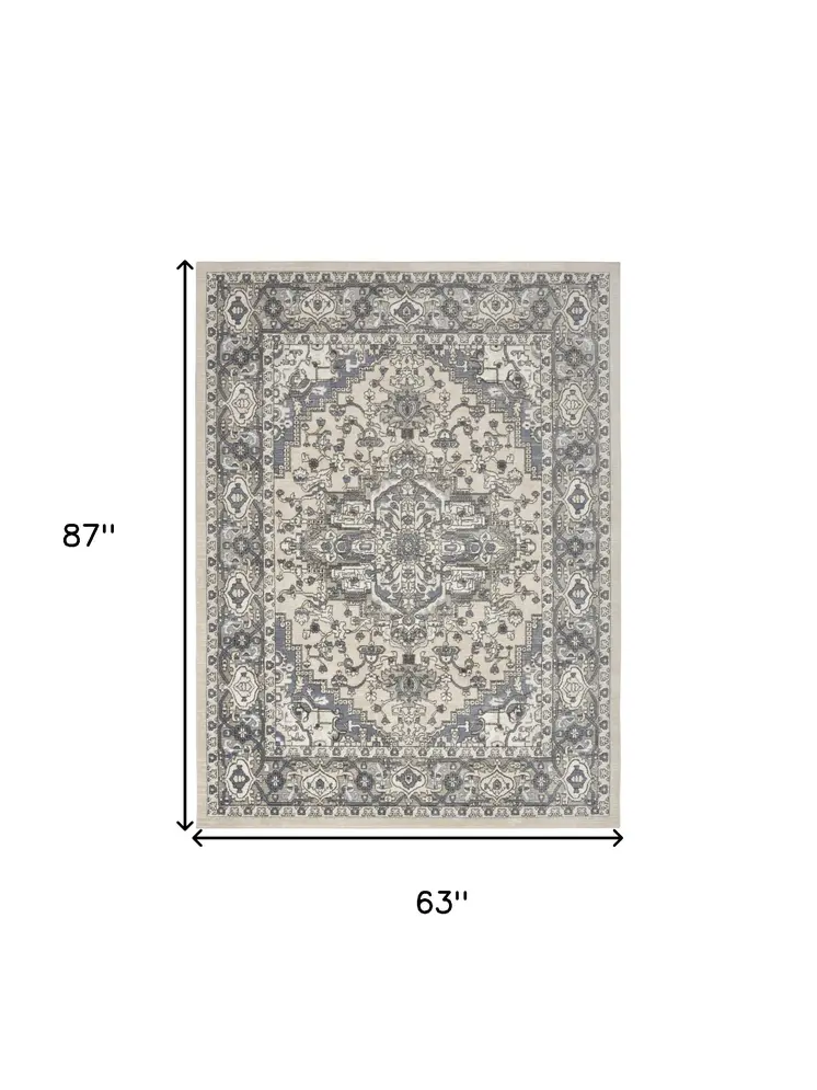 5' X 7' Blue and Ivory Medallion Power Loom Distressed Area Rug