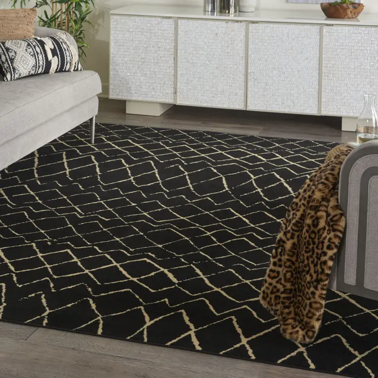 7' X 10' Black and Ivory Abstract Power Loom Distressed Area Rug
