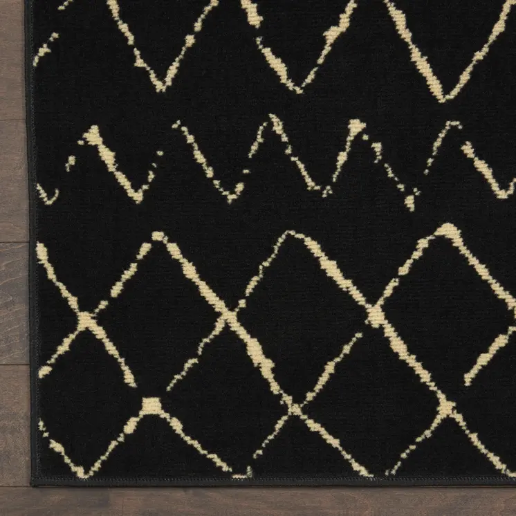 4' X 6' Black and Ivory Abstract Power Loom Distressed Area Rug