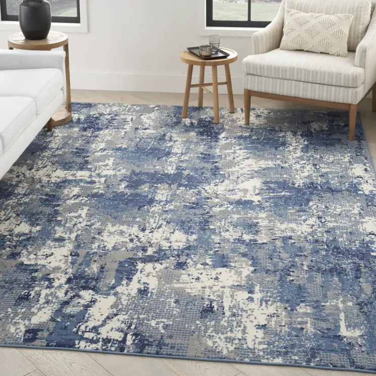 5' X 7' Blue and Ivory Abstract Power Loom Area Rug