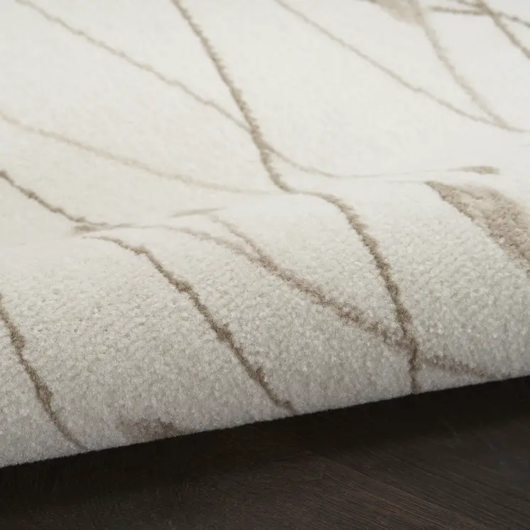 8' X 10' Beige and Ivory Floral Power Loom Area Rug