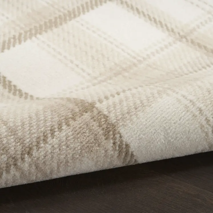 5' X 7' Beige and Ivory Plaid Power Loom Area Rug