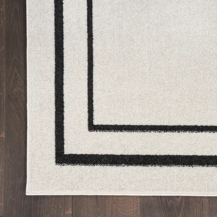 9' X 12' Ivory And Black Indoor Outdoor Area Rug