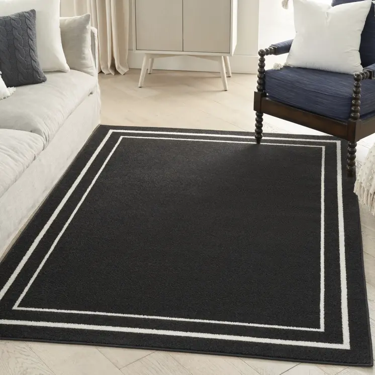 5' X 7' Black And Ivory Indoor Outdoor Area Rug