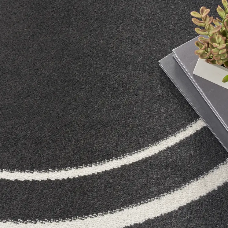 8' Black And Ivory Round Indoor Outdoor Area Rug