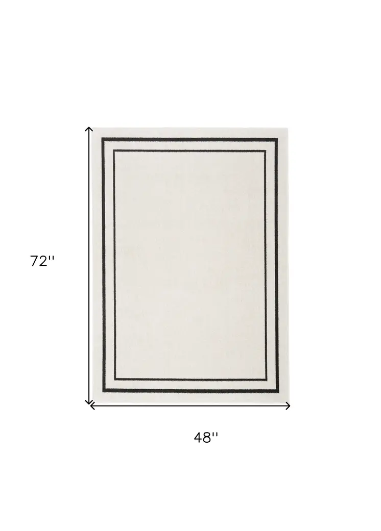4' X 6' Ivory And Black Indoor Outdoor Area Rug