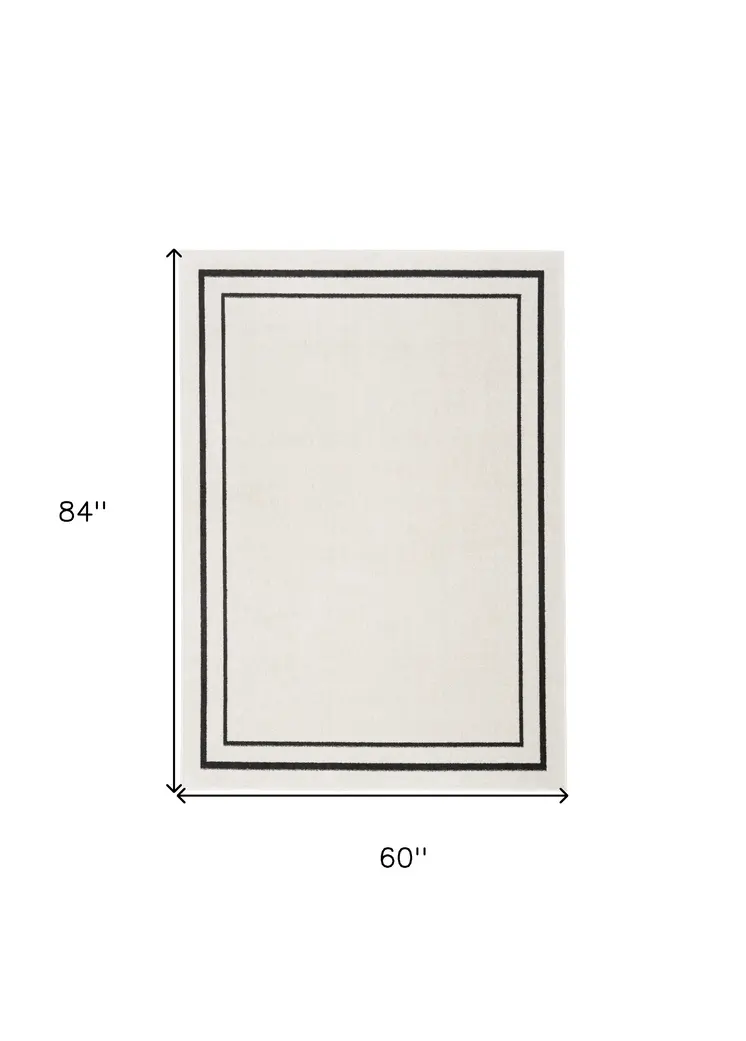 5' X 7' Ivory And Black Indoor Outdoor Area Rug