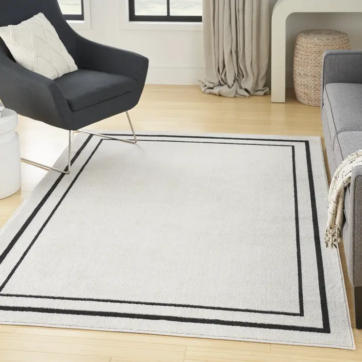 6' X 9' Ivory And Black Indoor Outdoor Area Rug