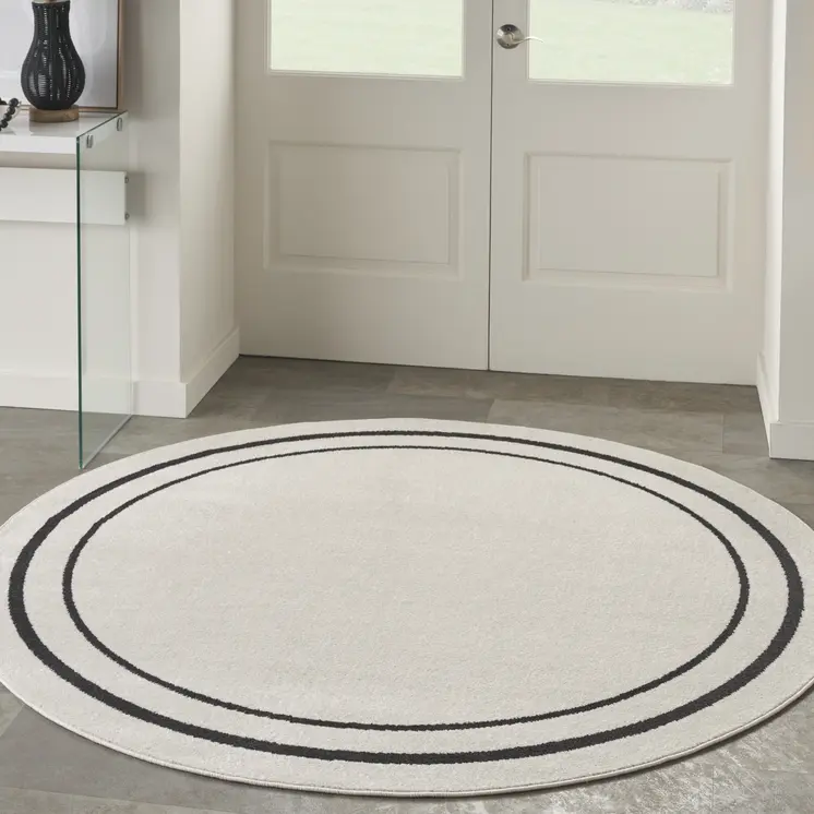 8' Ivory And Black Round Indoor Outdoor Area Rug
