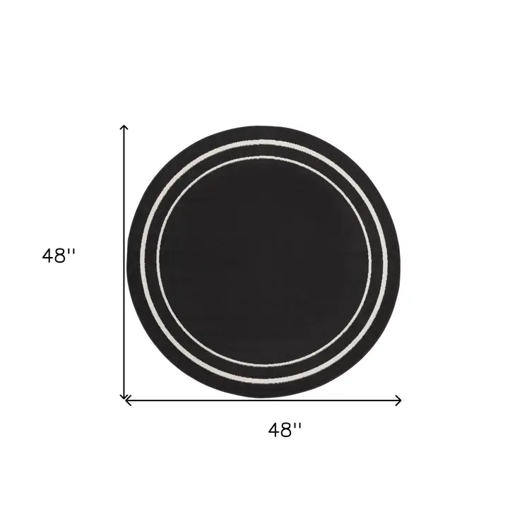 4' Black And Ivory Round Indoor Outdoor Area Rug