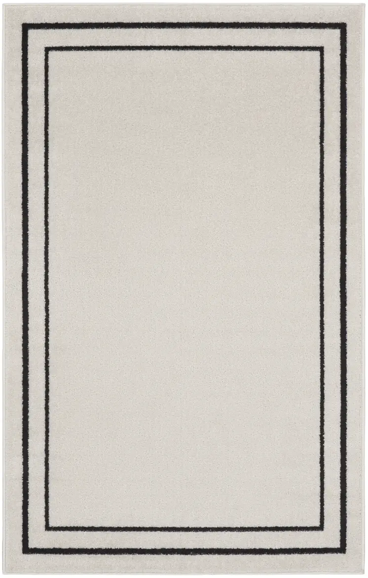 3' X 5' Ivory And Black Indoor Outdoor Area Rug
