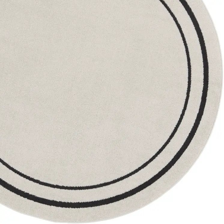 4' Ivory And Black Round Indoor Outdoor Area Rug