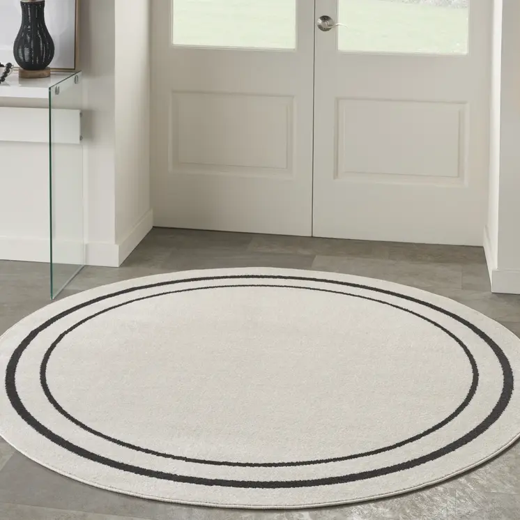 4' Ivory And Black Round Indoor Outdoor Area Rug