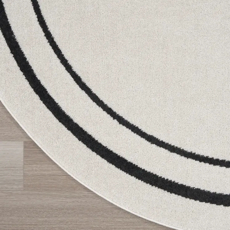 4' Ivory And Black Round Indoor Outdoor Area Rug