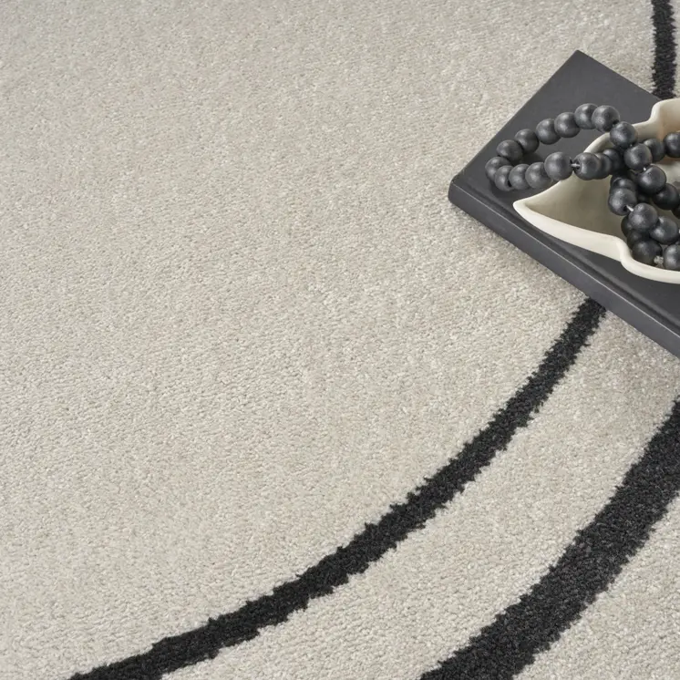 6' Ivory And Black Round Indoor Outdoor Area Rug