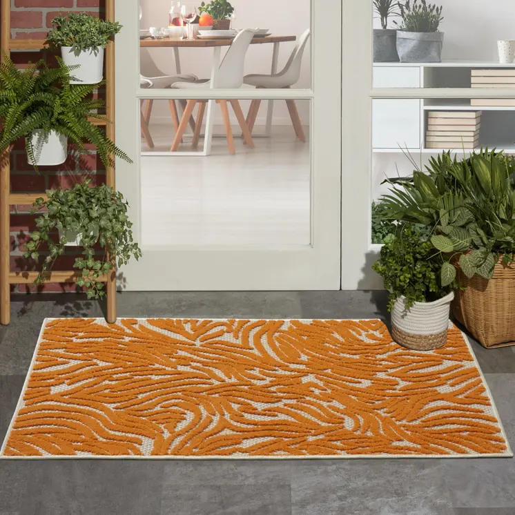 3' X 4' Orange And Ivory Animal Print Indoor Outdoor Area Rug