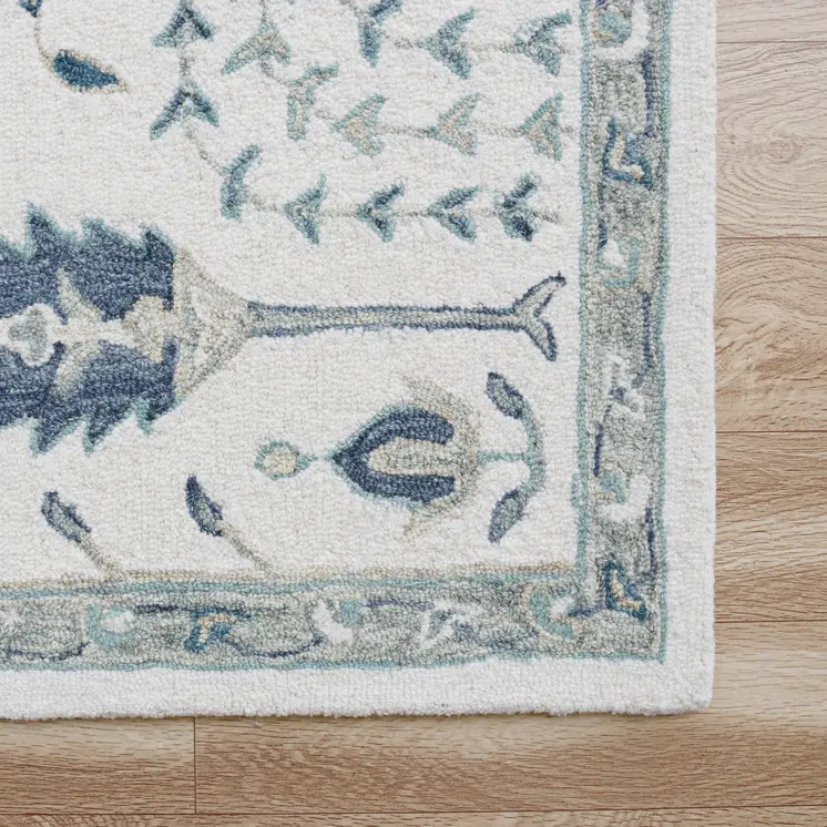 8' X 10' Ivory and Blue Wool Floral Hand Tufted Area Rug
