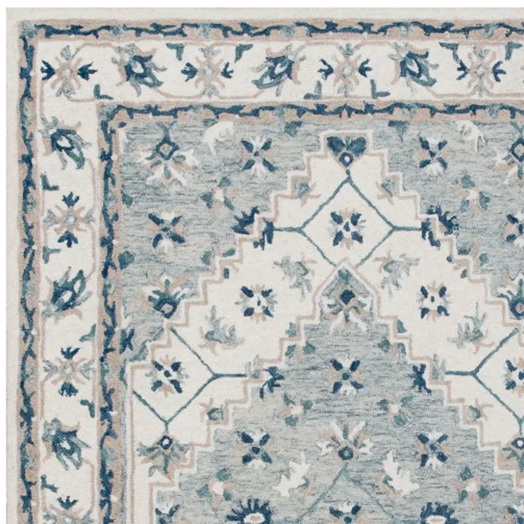 9' X 12' Blue and Ivory Wool Floral Hand Tufted Area Rug