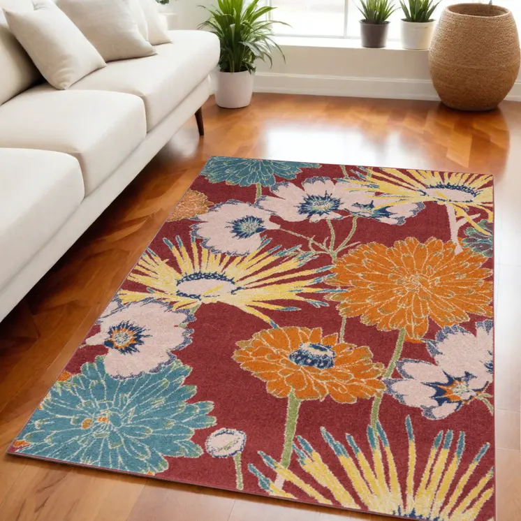 5' X 7' Orange and Red Floral Power Loom Area Rug