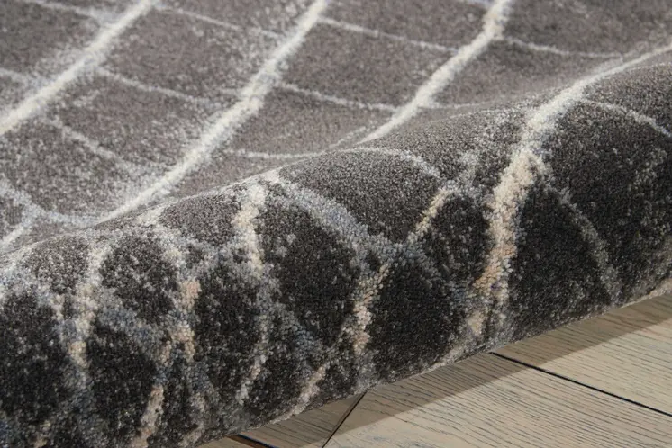 5' X 7' Beige Charcoal and Cream Animal Print Distressed Non Skid Area Rug