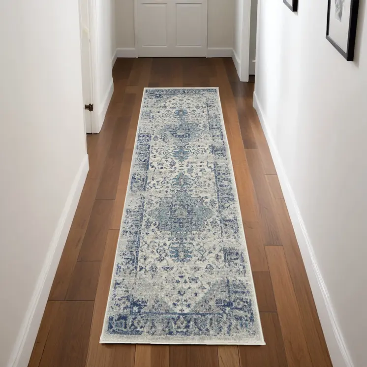 7' Ivory And Light Blue Floral Medallion Distressed Runner Rug