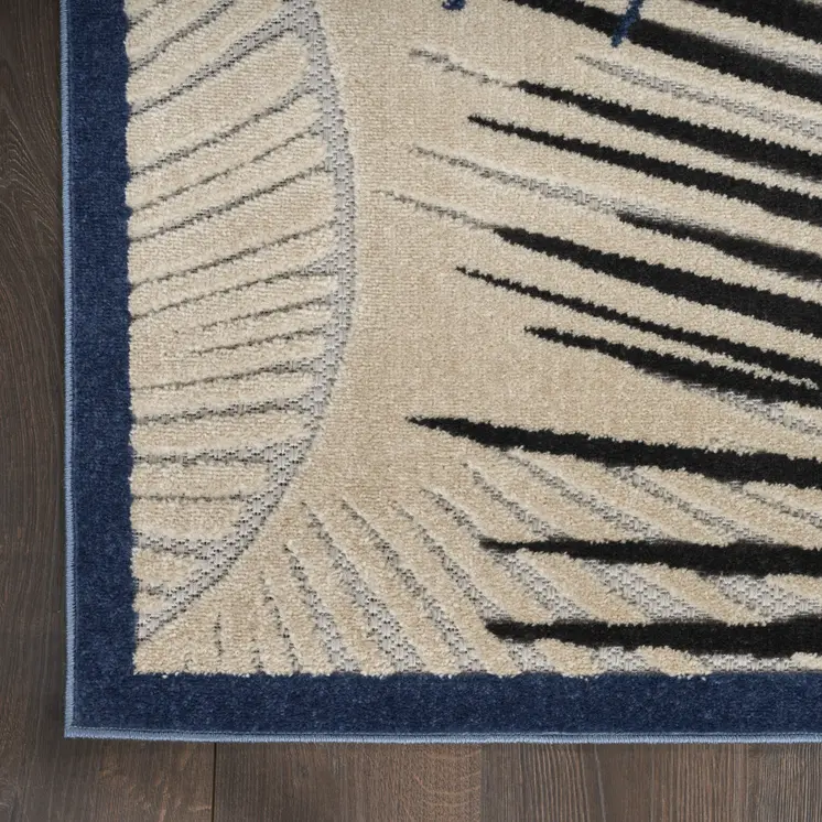 5' X 7' Navy Blue Ivory And Black Palm Leaf Indoor Outdoor Area Rug