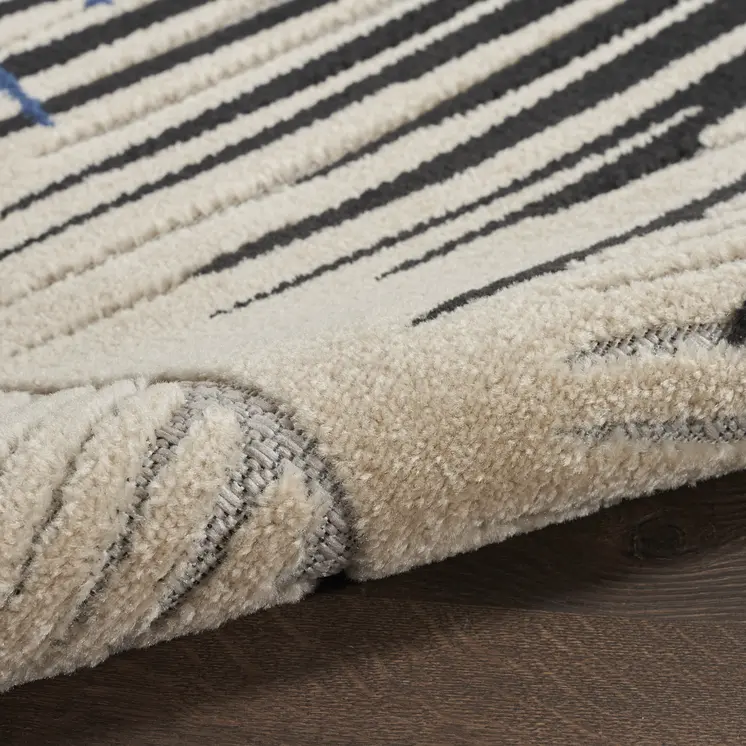 5' X 7' Navy Blue Ivory And Black Palm Leaf Indoor Outdoor Area Rug