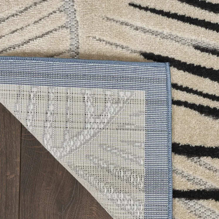 8' X 10' Navy Blue Ivory And Black Palm Leaf Indoor Outdoor Area Rug