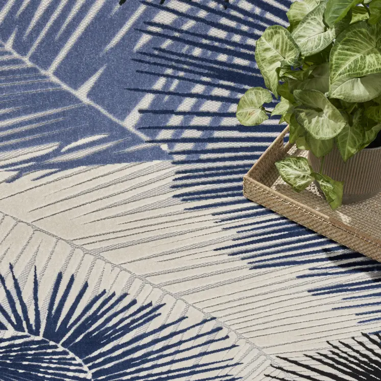 8' X 10' Navy Blue Ivory And Black Palm Leaf Indoor Outdoor Area Rug