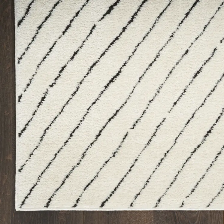 5' X 7' Ivory and Black Abstract Area Rug